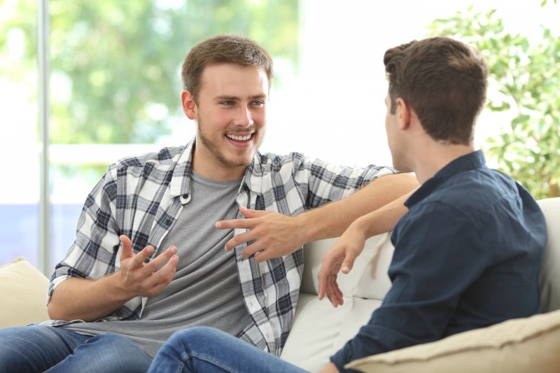 Patient with Invisalign talking to family member